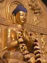 Golden Buddha with garland.